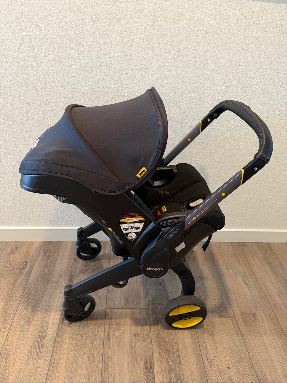 Doona Infant Car Seat & Stroller, Base, Sun shade, storage bag bundle